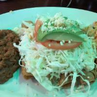 Flautas Dinner · Three flautas lettuce, sour cream, tomato, cheese, avocado rice and bean.