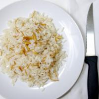 Almond Rice Salad · House salad with warm rice and golden almonds.