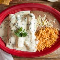 Popeye Enchiladas · Three chicken and spinach enchiladas topped with our savory Spinach dip served with rice and...