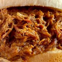Bbq Pulled Pork Sandwich · Our Savory Pulled Pork, Piled High on a Soft Bun. Try it with our House Made Spicy BBQ Sauce.