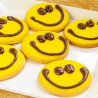 Smiley Face Cookies (1/2 Dz) · 1/2 dozen of our butter cutout cookies, iced and decorated with a smiley.