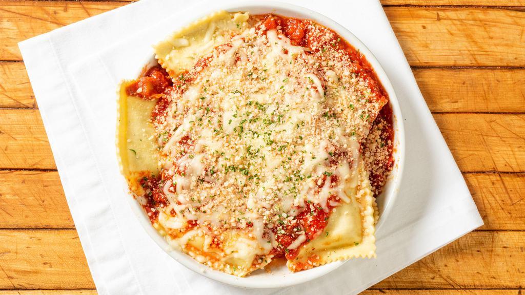 Meat Ravioli With Meat Sauce Dinner · Served with garden salad, Napoli stix and parmesan cheese.