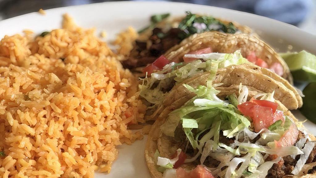 Taco Dinner · Three tacos served with beans and rice.
Meat choices are : STEAK,CHICKEN, PORK, GROUNDBEEF,  ONLY. 
Pick at least one choice of meat, maximum three from selections above.