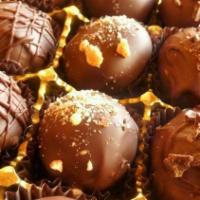 Dark Chocolate Truffles · Dark chocolate, 60% cacao. Crunchy chocolate shell on the outside and silky smooth filling o...