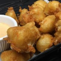 Cheese Curds · A Wisconsin favorite! Haus battered white cheese curds, naga-wicked pale ale beer batter, so...