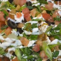 Nachos Brewhaus · Nachos brewhaus a large platter of fresh corn tortilla chips, queso sauce, lettuce, tomatoes...