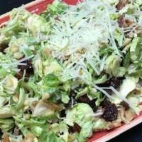 Brussels Sprout Salad · Shaved brussels sprouts combined with sweet county dried cherries, walnuts, bacon, shredded ...