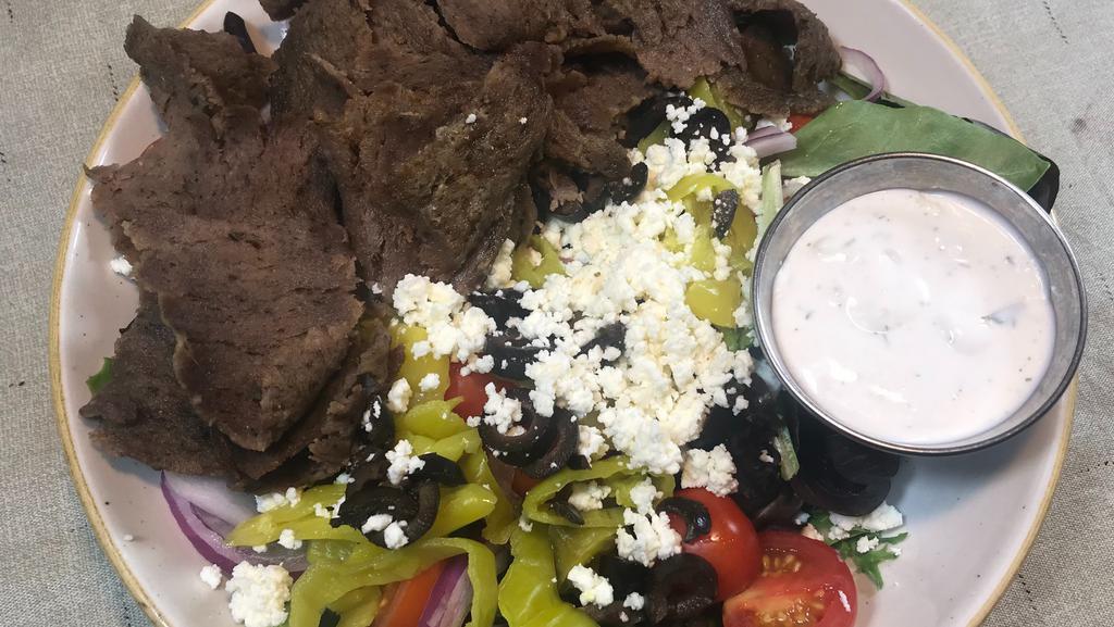 Grecian Salad · mixed greens topped with gyro meat, feta cheese, banana peppers, kalamata olives, red onion, and tomato serve with creamy cucumber dressing (dressing on side)