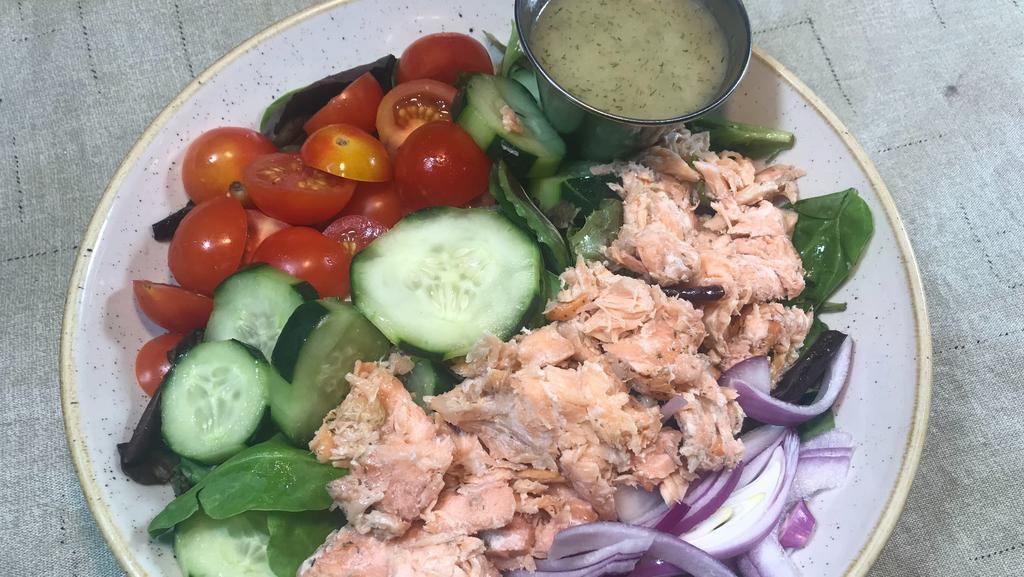 Smoked Salmon Salad · flaked smoked salmon atop mixed greens, tomatoes, cucumbers, and red onion served with lemon dill vinaigrette. (dressing on side)