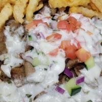 Gyro · Special combination of slow cooked lamb and beef served open faced on a pita bread, with cuc...