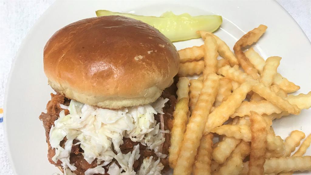 Haus Smoked Bbq Pork · hickory and applewood smoked pulled pork, naga-wicked bbq sauce, topped with creamy coleslaw served on a toasted butter bun