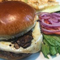 Mushroom Swiss Burger · topped with sautéed mushrooms, Wisconsin swiss cheese served on a toasted butter bun with le...