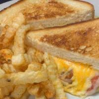 Wisconsin Grilled Cheese · sharp cheddar and muenster cheeses with slices of tomato on grilled sour dough.