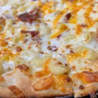 Mac & Cheese Pizza · Mac and cheese pizza, our haus' recipe macaroni and cheese, bacon crumble.