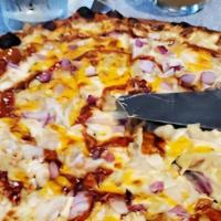 Bbq Chicken Pizza · The chef's favorite. Our homemade bbq sauce topped with shredded chicken, red onions and moz...
