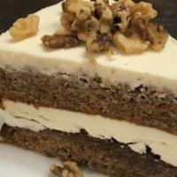 Carrot Cake · House made carrot cake, cream cheese frosting, toasted walnuts.