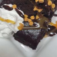 Haus Made Brownie · Warm haus made brownie with chocolate and butterscotch chips, caramel sauce, whipped cream a...
