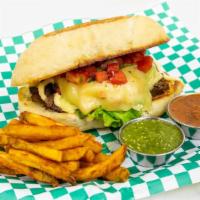Pan De Bistec · Grilled steak, swiss cheese, lettuce, pico de gallo and mayo