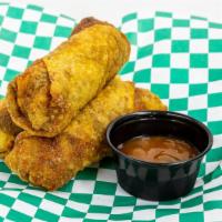 Cuban Egg Rolls · 3 Cuban egg rolls with cabbage, ground beef, chorizo, corn, rice and beans. Comes with sweet...