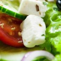 Greek Salad (Large) · Crisp romaine lettuce, fresh tomatoes, onions, cucumbers, feta cheese, kalamata olives and G...