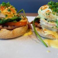 Classic Benedict · Poached eggs on toasted english muffin with spinach, tomatoes, ham, and hollandaise sauce