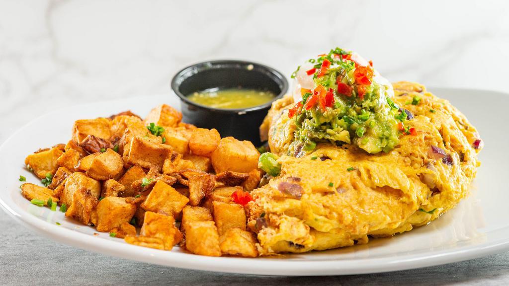 Mexicana Omelette · Avocado, chicken chorizo, onion, jalapeno, and cheddar jack cheese topped with sour cream and a side of salsa verde