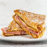 Monte Cristo · Grilled ham, scrambled egg, and swiss cheese sandwiched between two extra thick slices of fr...