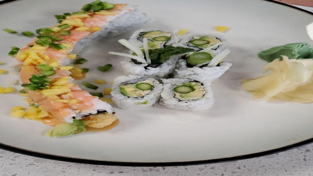 Cancun Roll · Shrimp tempura roll, topped with cooked shrimp, chopped jalapeno, mango and brown sauce and spicy sauce.