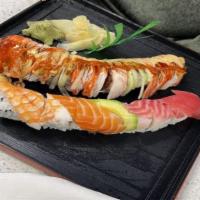 Rainbow Roll · 8 pieces. Crab meat, avocado, cucumber topped with three different kinds of fish, crab meat ...