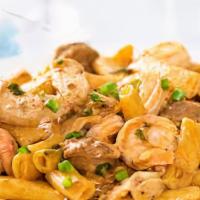 New Orleans Pasta · Penne pasta tossed with chicken, shrimp, sausage and vegetables in a Cajun spice cream sauce.