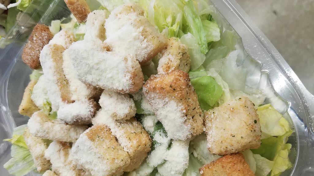 Caesar Salad · Romaine lettuce, tossed with Parmesan cheese, Caesar dressing and topped with croutons.