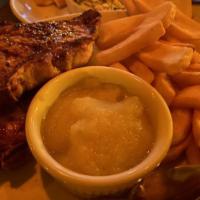 Center Cut Pork Chops · Twin, perfectly seasoned chops, grilled, and served with a side of applesauce. Tender and ju...