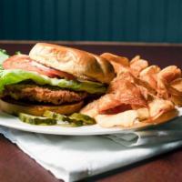 Pork Tenderloin · Breaded pork cutlet, deep fried till golden brown, finished with lettuce, tomato, and mayonn...
