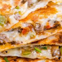 Philly Cheesesteak-Ritto · Flour tortilla served with steak, chopped onions, diced green peppers & provolone cheese.