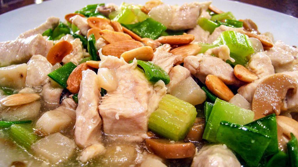 Chicken Almond · A delightful blending of chicken white meat with diced bamboo shoots, button mushrooms, snow peapods, and other Chinese vegetables.