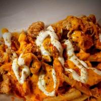Loaded Buffalo Fries  · French Fries, loaded with cheese, Chucks of chicken, Buffalo sauce, Ranch and seasoning
