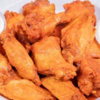 Buffalo Wings · 12 piece bone-in wings fried then dunked in your choice of sauce.