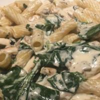 Rigatoni Alla Cucina · Grilled chicken, spinach, mushrooms and Parmesan garlic cream sauce.