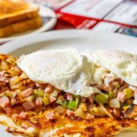 Fiesta Skillet · Two eggs cooked to order served over hash browns, cheddar cheese, mushrooms, onions, celery ...