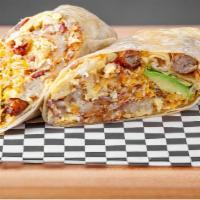 Breakfast Burrito · Filled with scrambled eggs, onions, tomatoes, sausage and cheese, topped with green chilies ...
