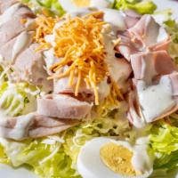 Chef Salad · A fresh bed of lettuce topped with turkey, ham, boiled eggs, tomatoes and cheese.