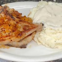 Country Pork Chops · Two delicious pork chops specially seasoned and grilled to perfection.