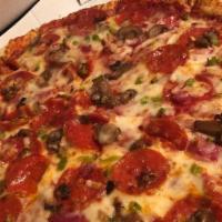 Deluxe · 100% Real Mozzarella Cheese, Margherita Pepperoni, Ham, Mushrooms, Green Peppers, and Onions.