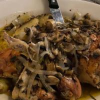 Chicken Vesuvio · Chicken sautéed with mushrooms,
onions and potatoes in a white wine,
oil and garlic sauce.