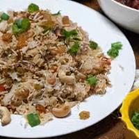 Chili Chicken Rice · Spicy Tender boneless chicken cooked with basmati rice.