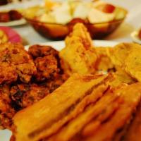 Iftar Box · Collection of:
- Dates (Khajoor)
- Pakodas
- Aaloo Samosa
- Chanay 
- Fruit Chaat