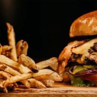 Shelby'S Double Stack · Two quarter-pound patties with lettuce, tomato American cheese, grilled onions and special s...