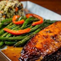 Cedar Plank Salmon · Atlantic salmon fillet on a cedar plank with bourbon glaze, served with a side of rice and s...
