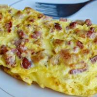 Meat-Lovers Omelette · Made with three eggs, ham, bacon, sausage and cheese. Served with hash browns and your choic...