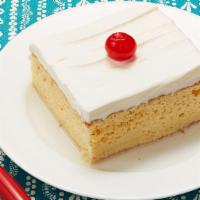 Tres Leches · Sponge cake soaked in three types of milk.